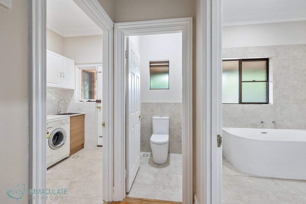 Renovated Perth home with connected laundry, toilet, and modern bathroom featuring freestanding bath by Immaculate Bathrooms
